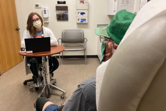 NP Elise Wildern with patient