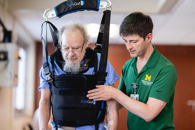 Mary Free Bed Carousel - Man in Harness with Physical Therapist