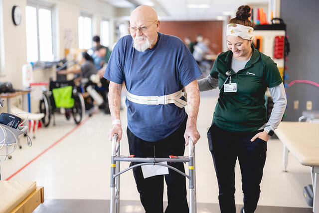 Mary Free Bed Carousel - Older Man with Walker and Physical Therapist