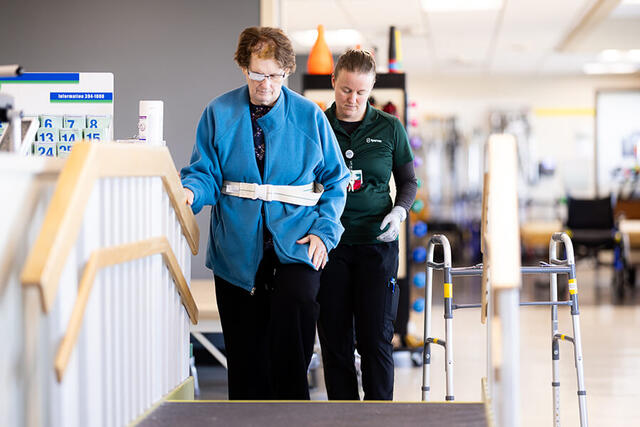 Mary Free Bed Carousel - Woman Walking on Stairs