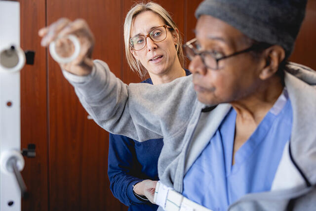 Mary Free Bed Carousel - Woman with Rings and Physical Therapist